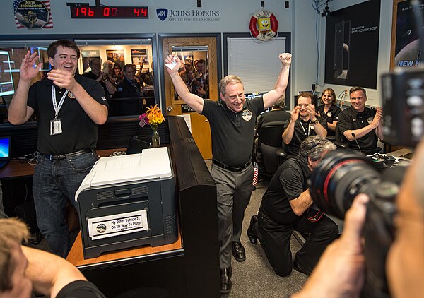 Alan Stern celebrating the successful flyby of Pluto by New Horizons in 2015 in the APL Mission Operations Center.