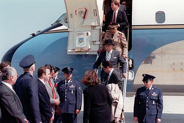 Balaguer (right) and his cabinet arrive in the US for a state visit in 1988